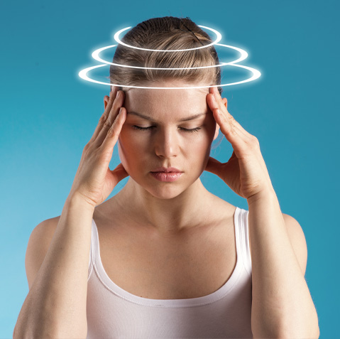 woman pressing the sides of her head to try and relieve concussion symptoms